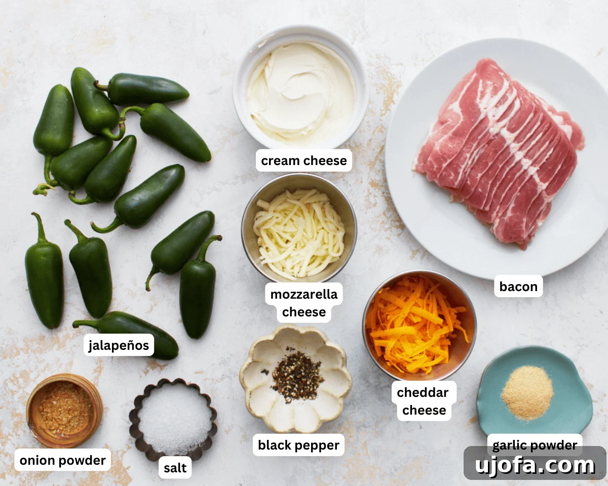 A selection of fresh keto jalapeño poppers ingredients laid out on a clean surface, ready for preparation.