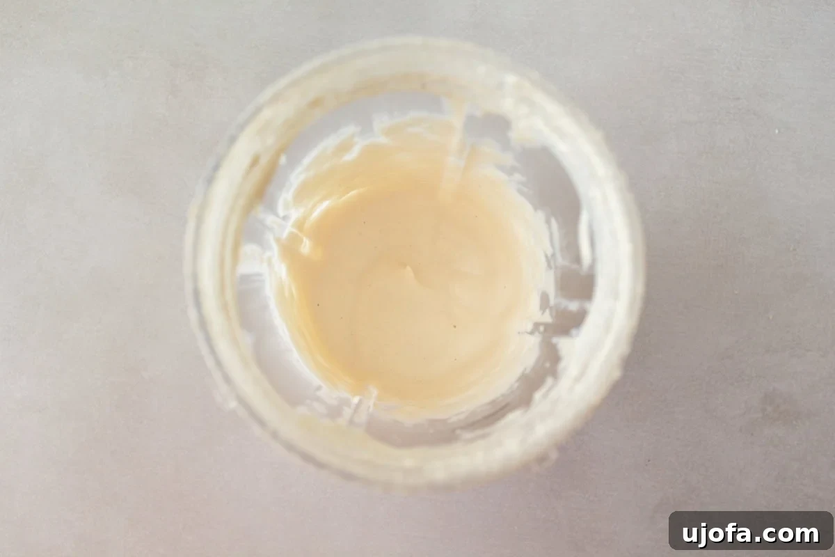 blended cashew cream in a blender cup