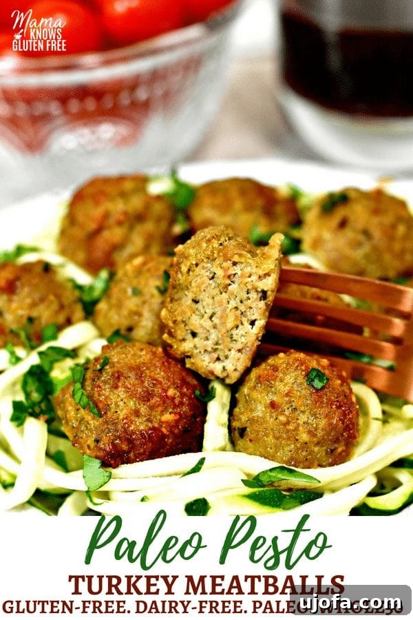 Delicious Paleo Pesto Turkey Meatballs served with zucchini noodles, perfect for a healthy dinner. Pin this recipe!