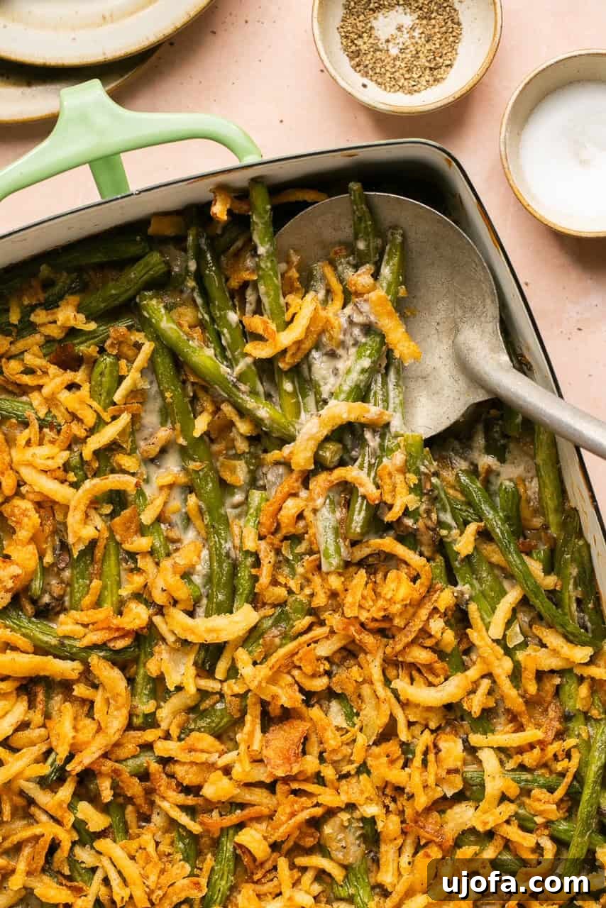 a close up of fried onions mixed with green beans