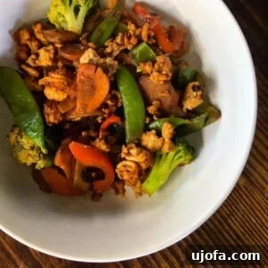 Close-up of Chinese Turkey Stir-Fry, garnished with fresh herbs.