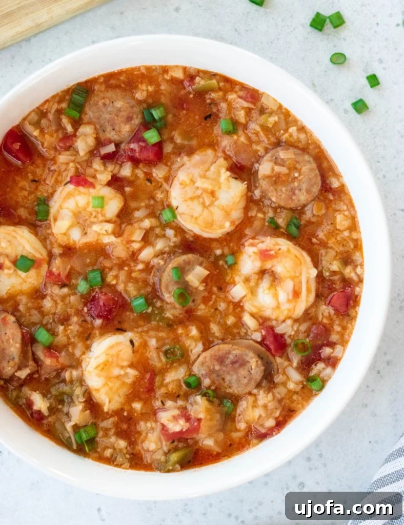 Instant Pot Whole30 Jambalaya Soup with sausage, chicken, and vibrant vegetables.