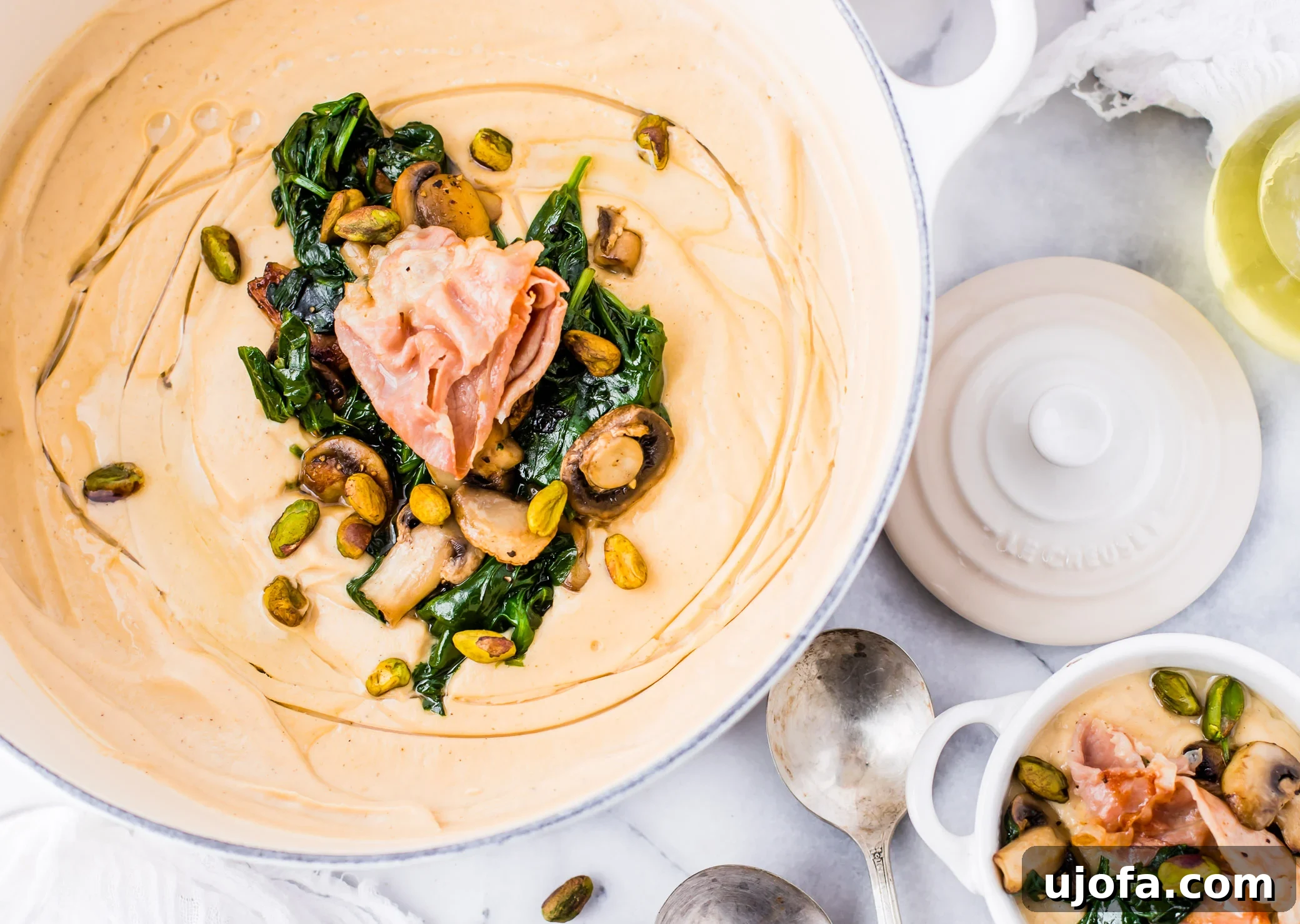 Whole30 Roasted Garlic Cauliflower Soup, creamy and flavorful with crispy prosciutto.