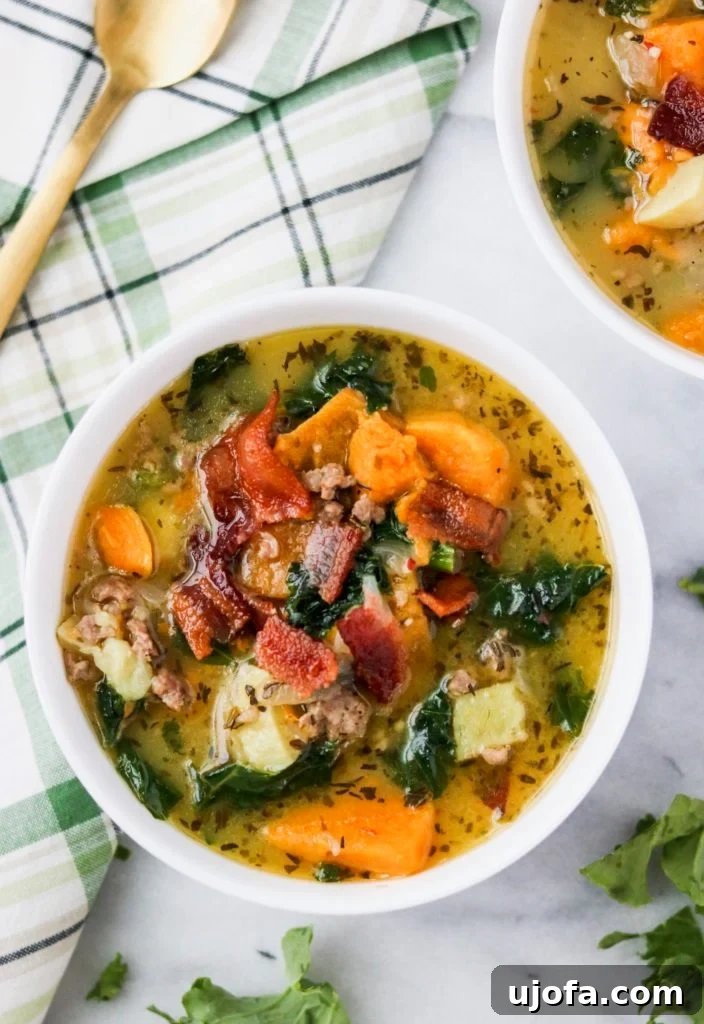 Whole30 Zuppa Toscana, a creamy, savory soup with sausage and greens.