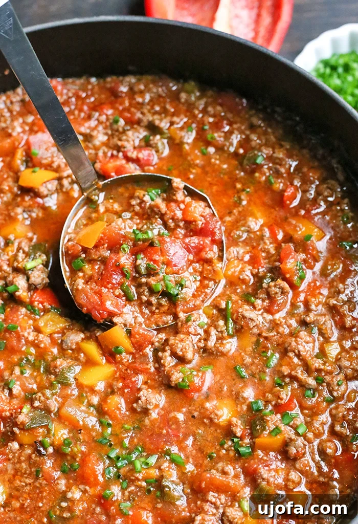 Paleo Whole30 Stuffed Pepper Soup, a comforting blend of meat, peppers, and tomato broth.