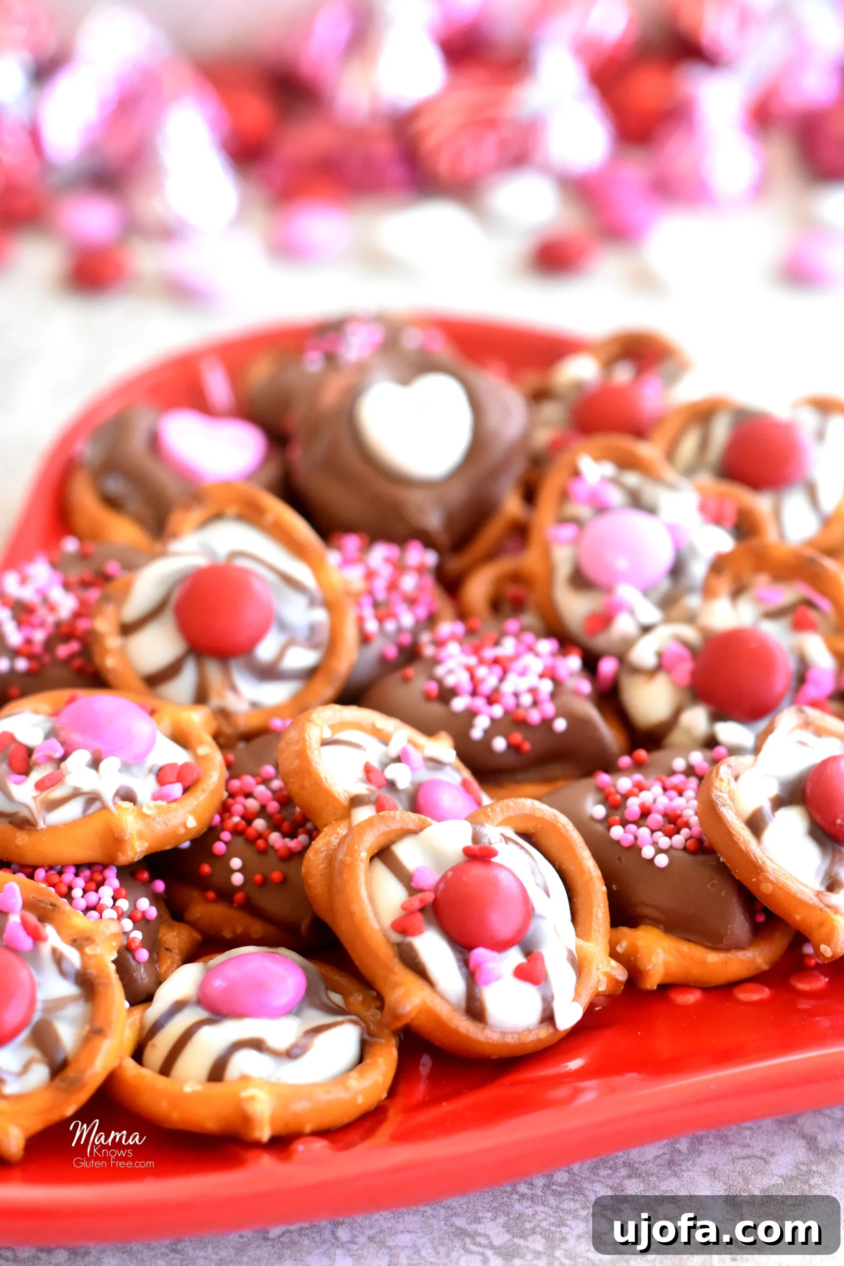 Irresistible Gluten Free Chocolate Pretzels for Valentines 2 Gluten-free chocolate covered pretzels arranged on a heart-shaped plate for Valentine's Day