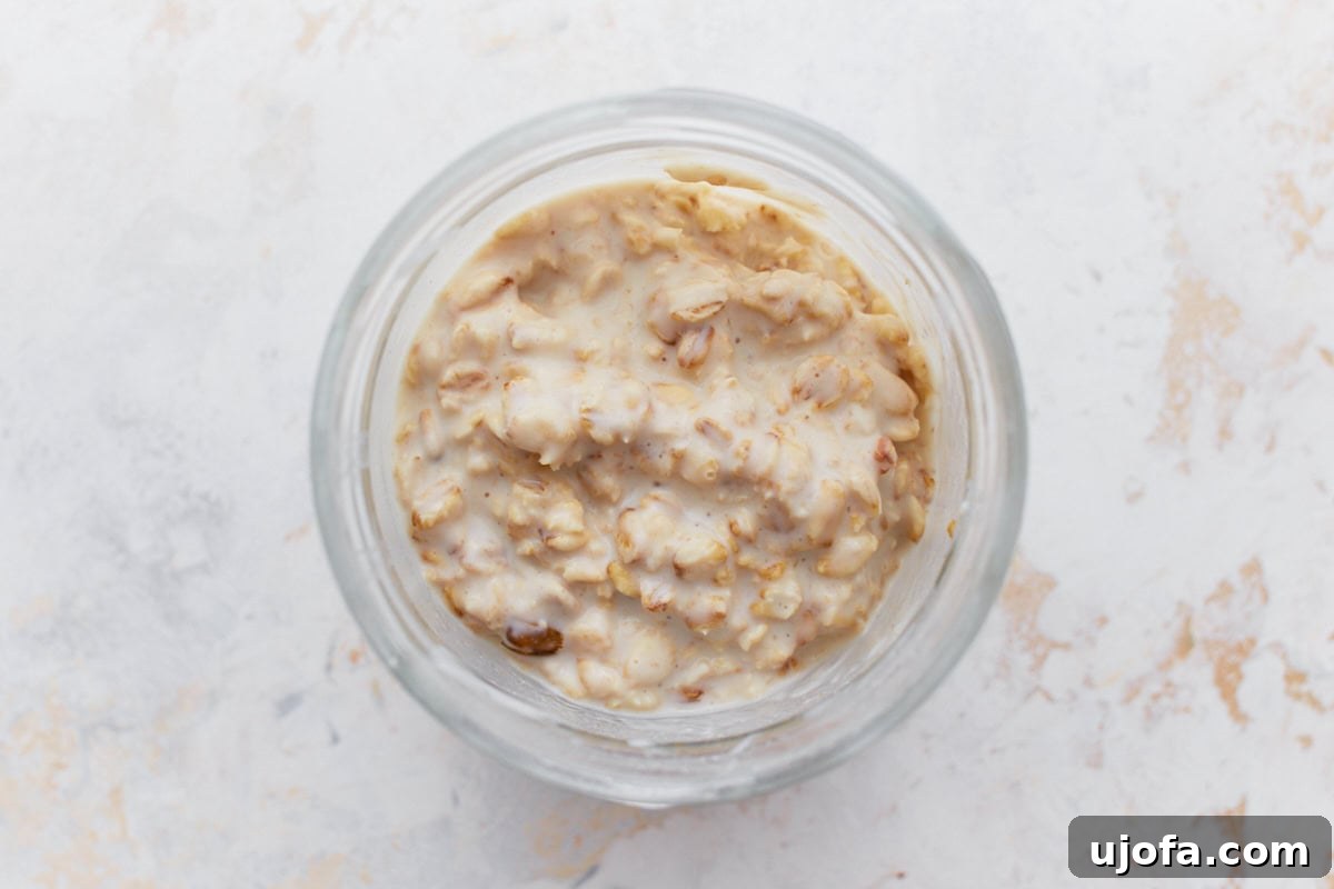 Gluten-Free Overnight Oats: Prep Today, Enjoy Tomorrow 7 A jar of gluten-free overnight oats with a fully thickened and creamy texture after refrigeration.