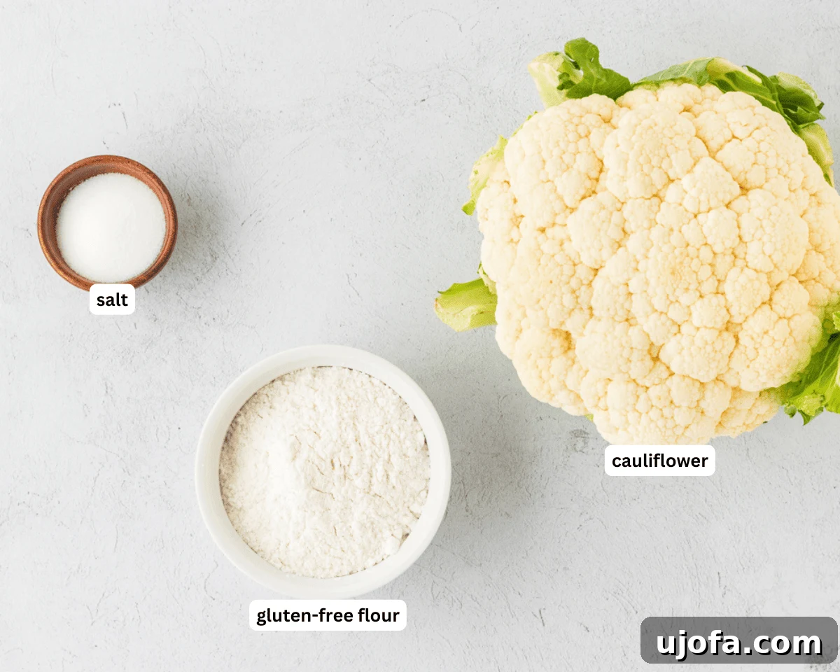 Various fresh ingredients laid out on a clean surface, including vibrant cauliflower florets, a bag of gluten-free all-purpose flour, and a small bowl of salt, all meticulously prepared and ready for making homemade gnocchi.