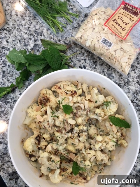 Roasted cauliflower florets tossed with spices before adding sauce.