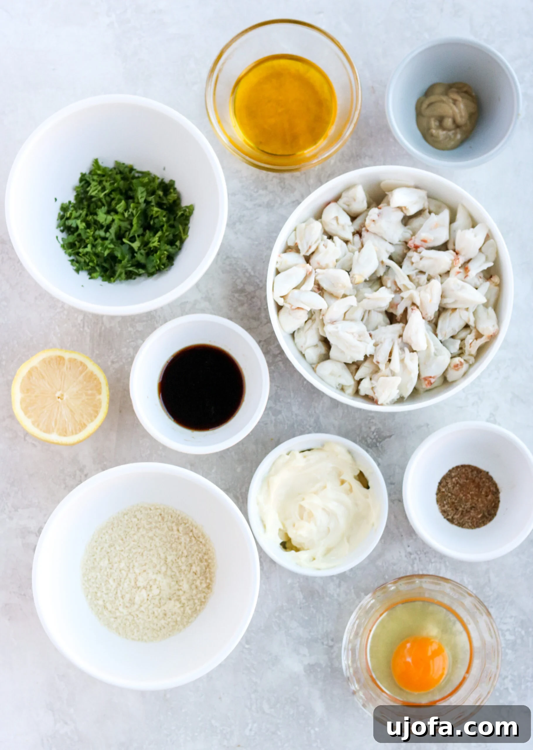 A vibrant flat lay of fresh ingredients laid out on a clean surface, ready to be combined for healthy crab cakes.