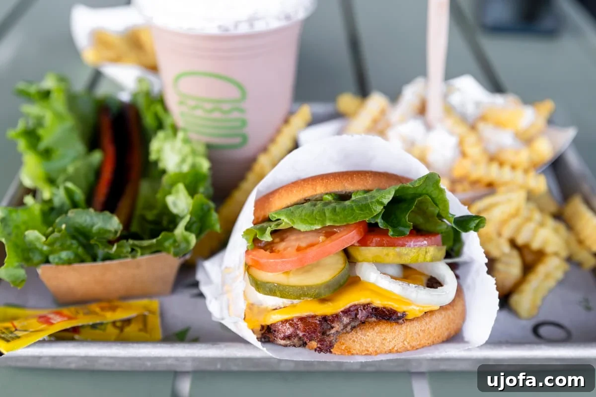 Shake Shack Gluten-Free Dining Guide 3 Assortment of gluten-free menu items from Shake Shack, including a burger, fries, and a milkshake.