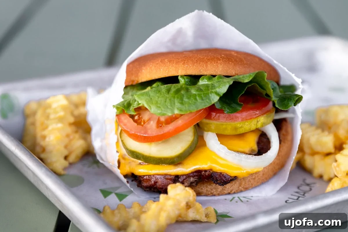 Shake Shack Gluten-Free Dining Guide 7 A delicious gluten-free cheeseburger from Shake Shack, presented on a lettuce wrap.