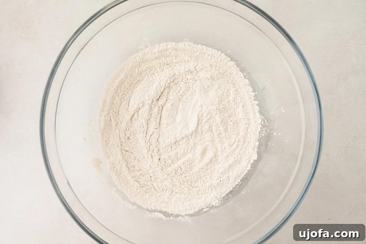 Grain-Free Cassava Wraps 5 A glass mixing bowl filled with a well-blended mixture of dry ingredients for cassava flour tortillas.