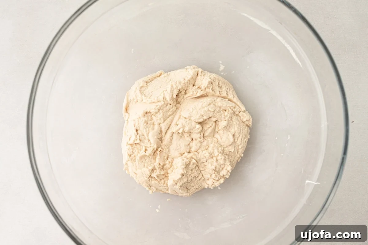 Grain-Free Cassava Wraps 6 Cassava tortilla dough formed into a cohesive ball inside a glass mixing bowl, after wet ingredients are added.