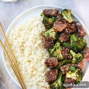 Sheet Pan Beef and Broccoli with sauce and sesame seeds