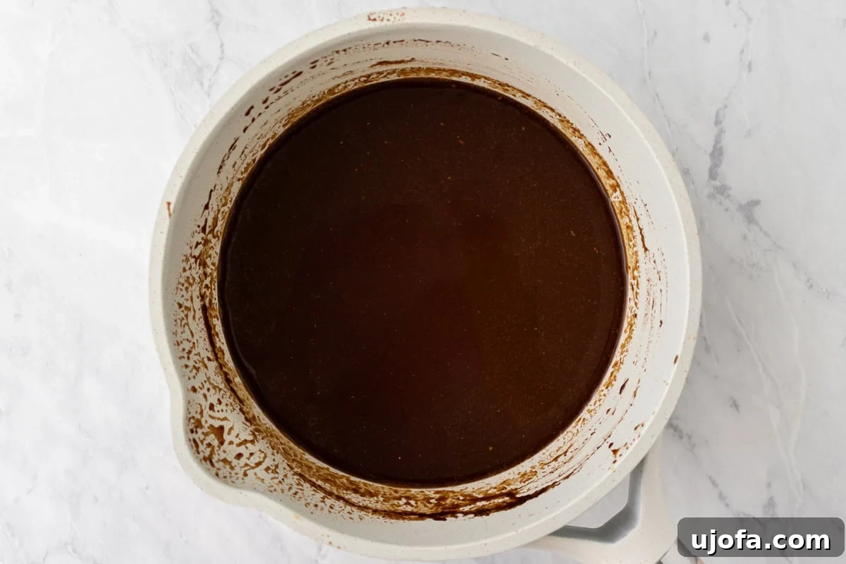 Gluten-Free Worcestershire from Scratch 10 The sauce in the same pot after simmering and cooling, darker and smoother in appearance