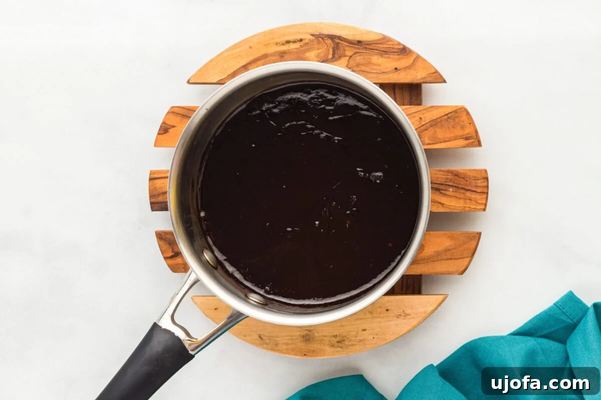 Craft Your Own Gluten-Free Hoisin Sauce 6 Saucepan filled with smooth, thickened hoisin sauce after simmering.