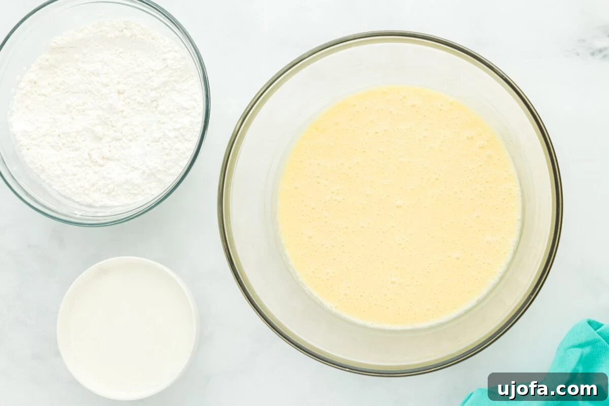 A bowl of whipped wet ingredients next to bowls of gluten-free flour and buttermilk, prepped for combining.