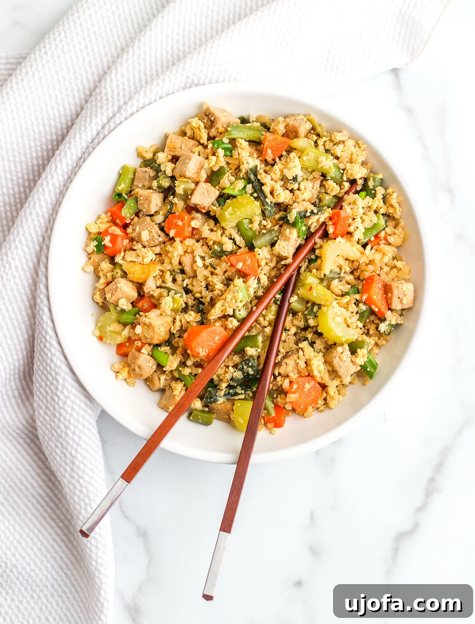 Pork Fried Cauliflower Rice cooking in a skillet