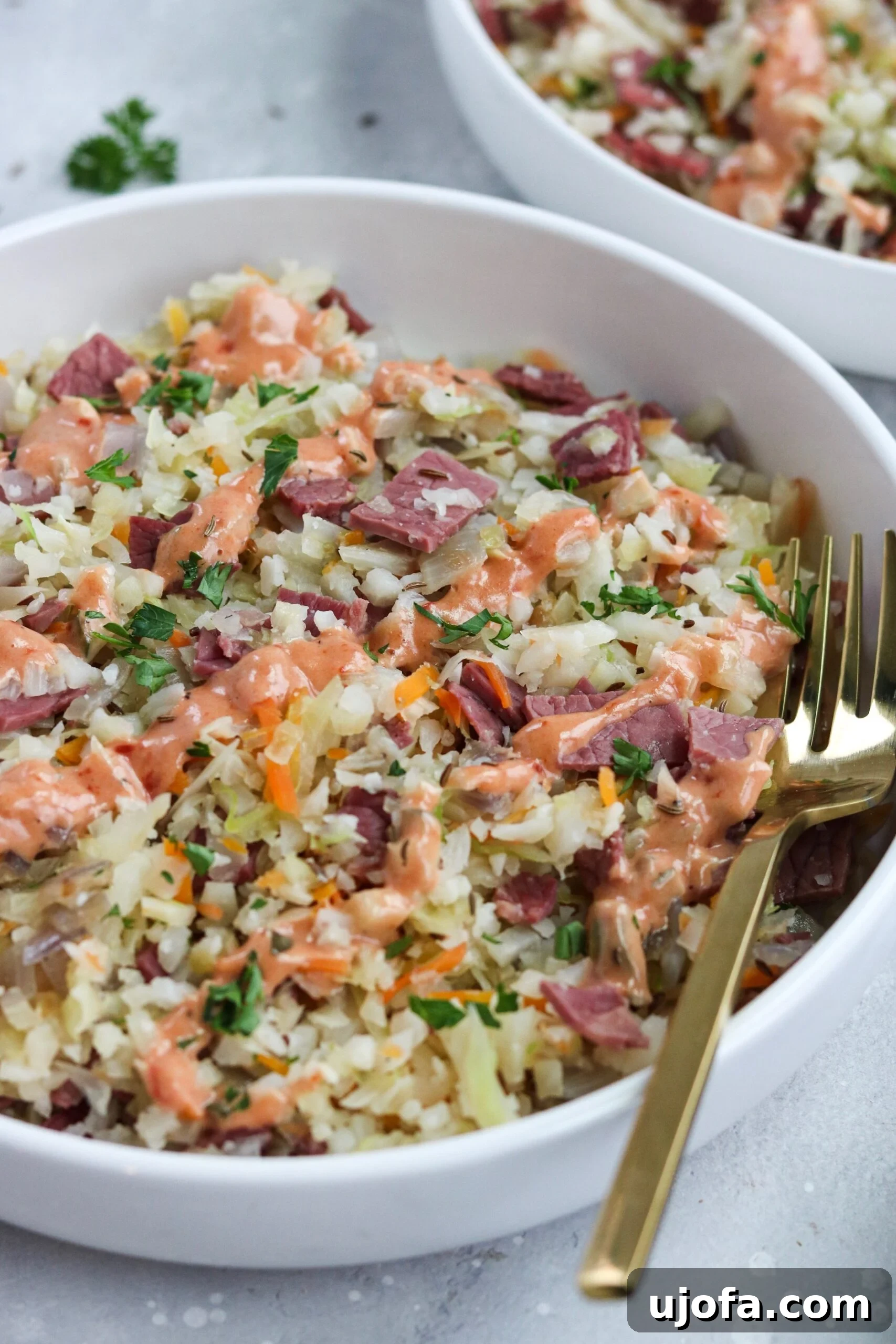 Reuben in a Bowl garnished with fresh parsley, highlighting the vibrant colors of the ingredients