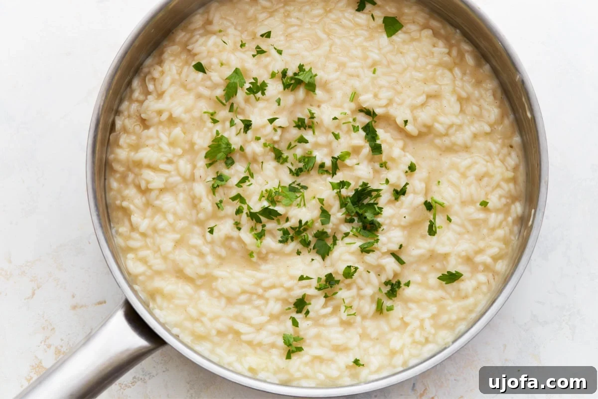Gluten-Free Risotto Bliss 11 Finished gluten-free risotto in the pan, generously garnished with fresh parsley, ready for serving.