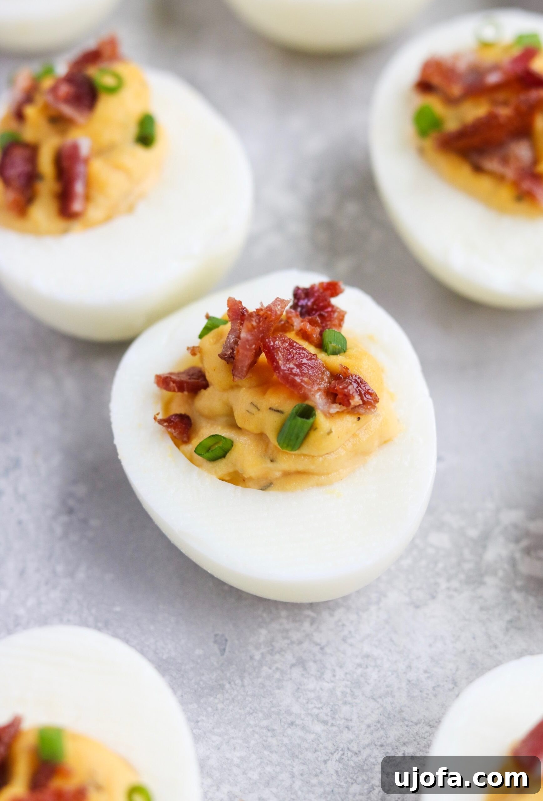 Decadent Whole30 Bacon Ranch Deviled Eggs 6 Plate of Whole30 Bacon Ranch Deviled Eggs garnished with chives