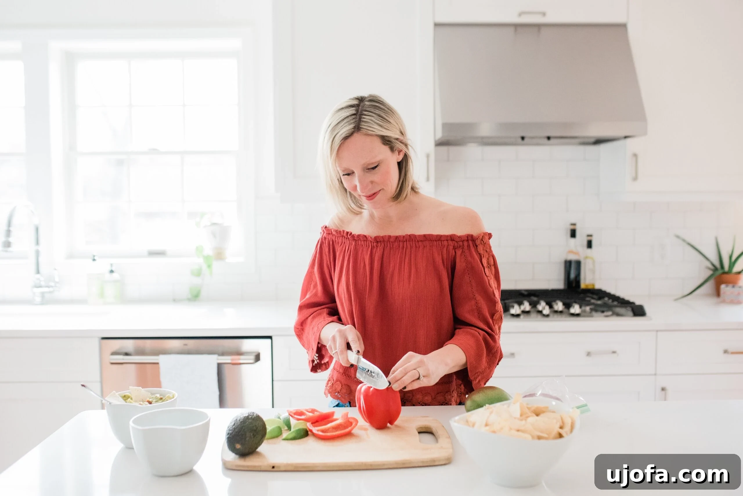 A person passionately preparing and photographing a healthy, delicious meal in a well-lit kitchen, symbolizing the journey of a food blogger.