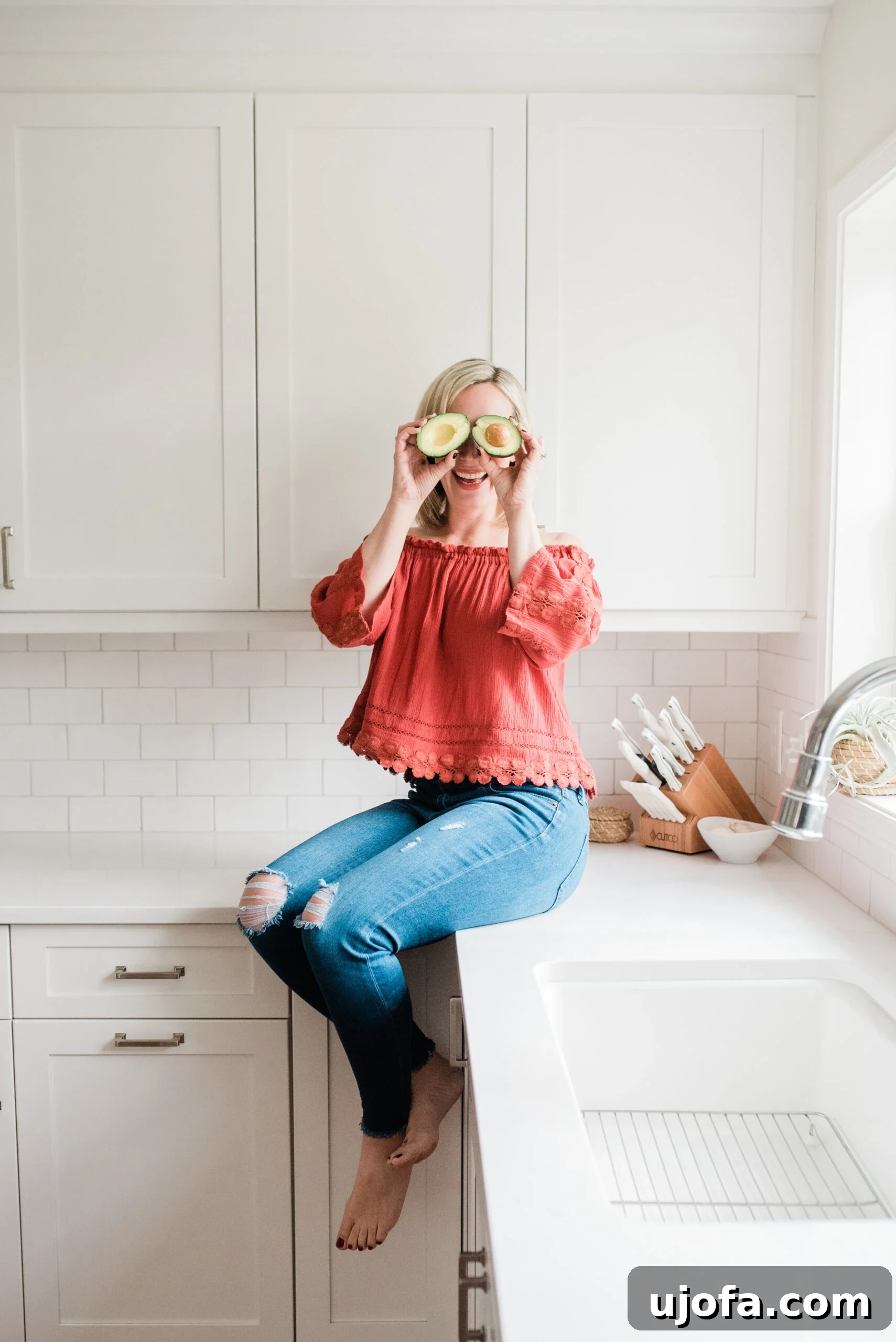 Mary, the food blogger, smiling confidently in her kitchen, surrounded by fresh ingredients and healthy food, representing her success.