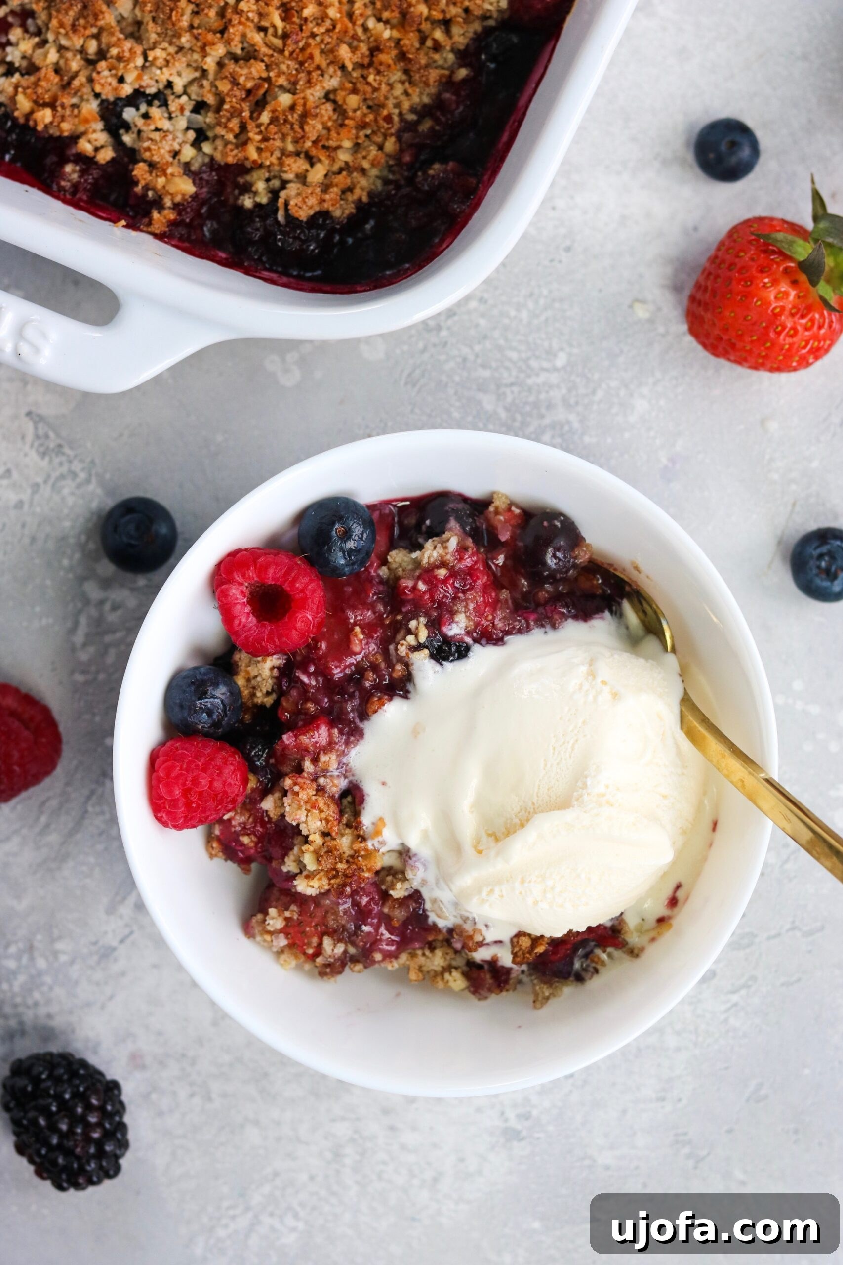 Paleo Vegan Berry Crumble 3 Prepared Paleo Vegan Berry Crisp, golden brown and bubbling, in a baking dish