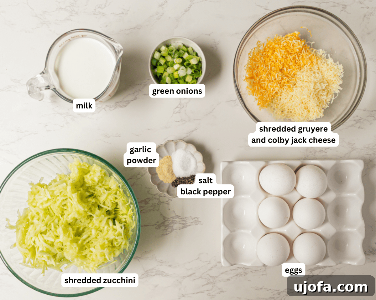 Fluffy Zucchini Egg Bake 4 A collection of fresh ingredients for crustless zucchini quiche, including shredded zucchini, eggs, half and half, green onions, and cheese, neatly arranged on a rustic wooden board.