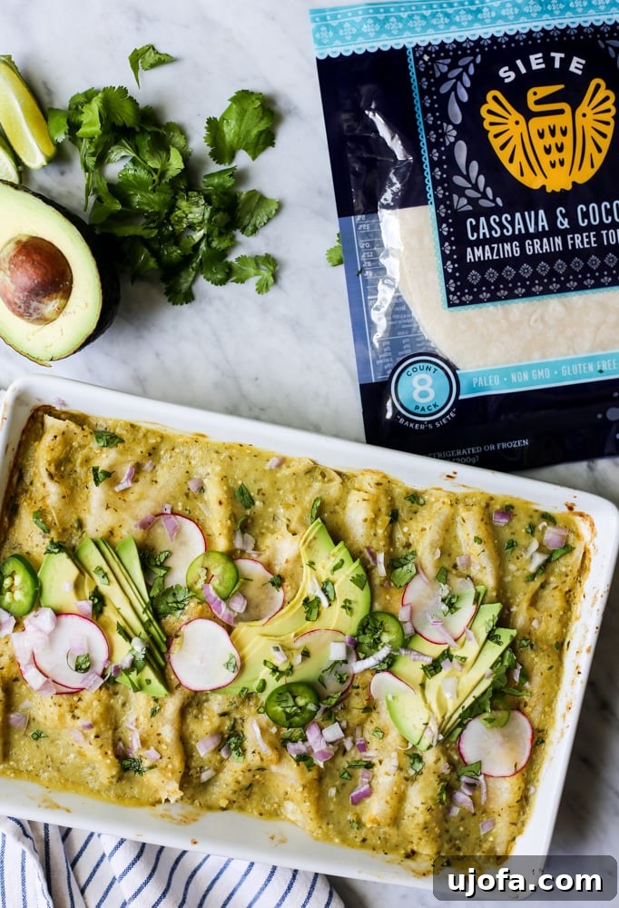 Fiesta-Ready Whole30 Paleo Mexican Meals 12 Authentic Paleo Enchiladas Verdes, smothered in a vibrant green sauce and topped with fresh herbs.