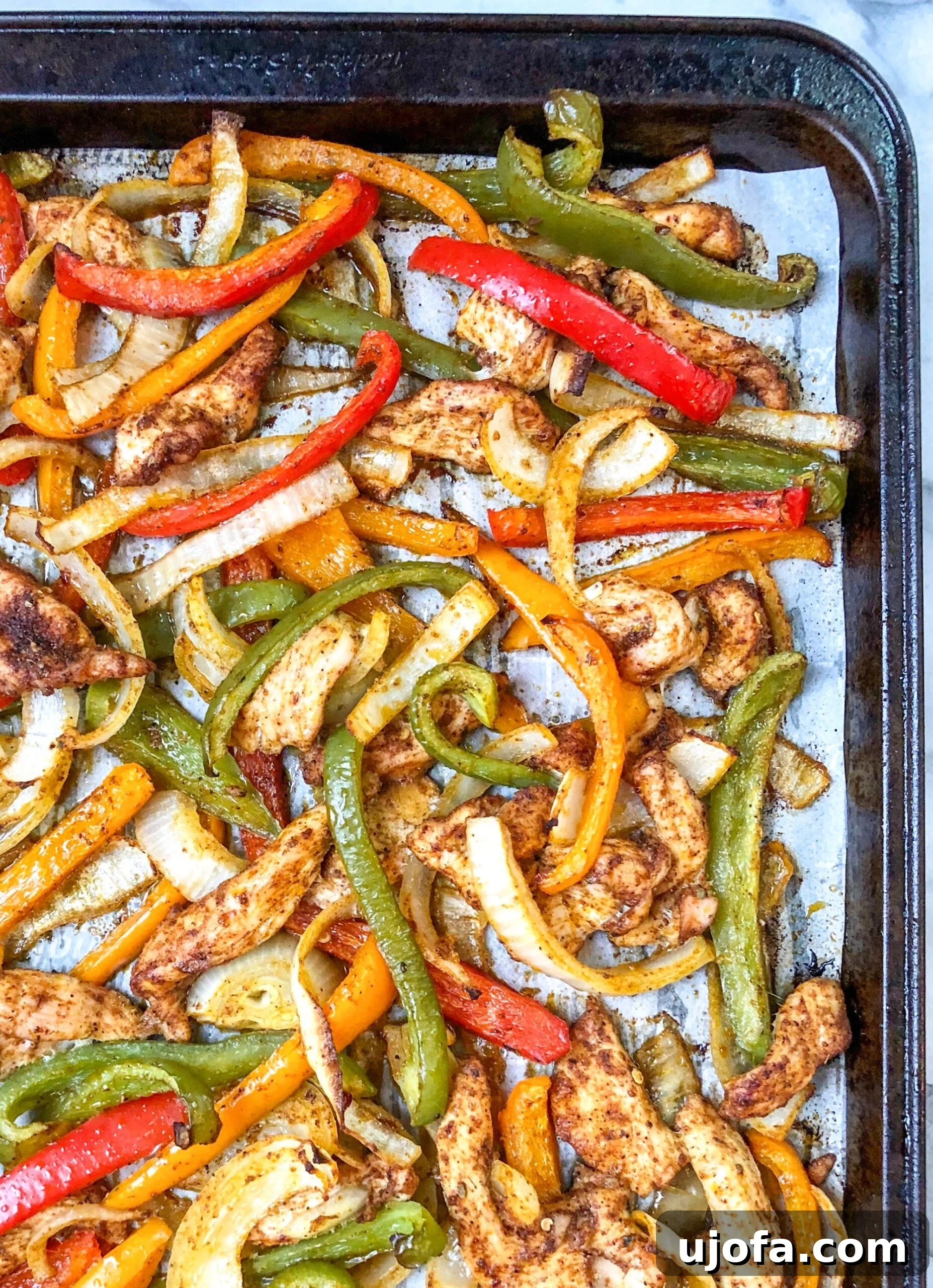 Fiesta-Ready Whole30 Paleo Mexican Meals 19 Colorful Whole30 Sheet Pan Chicken Fajitas, sizzling with bell peppers and onions.