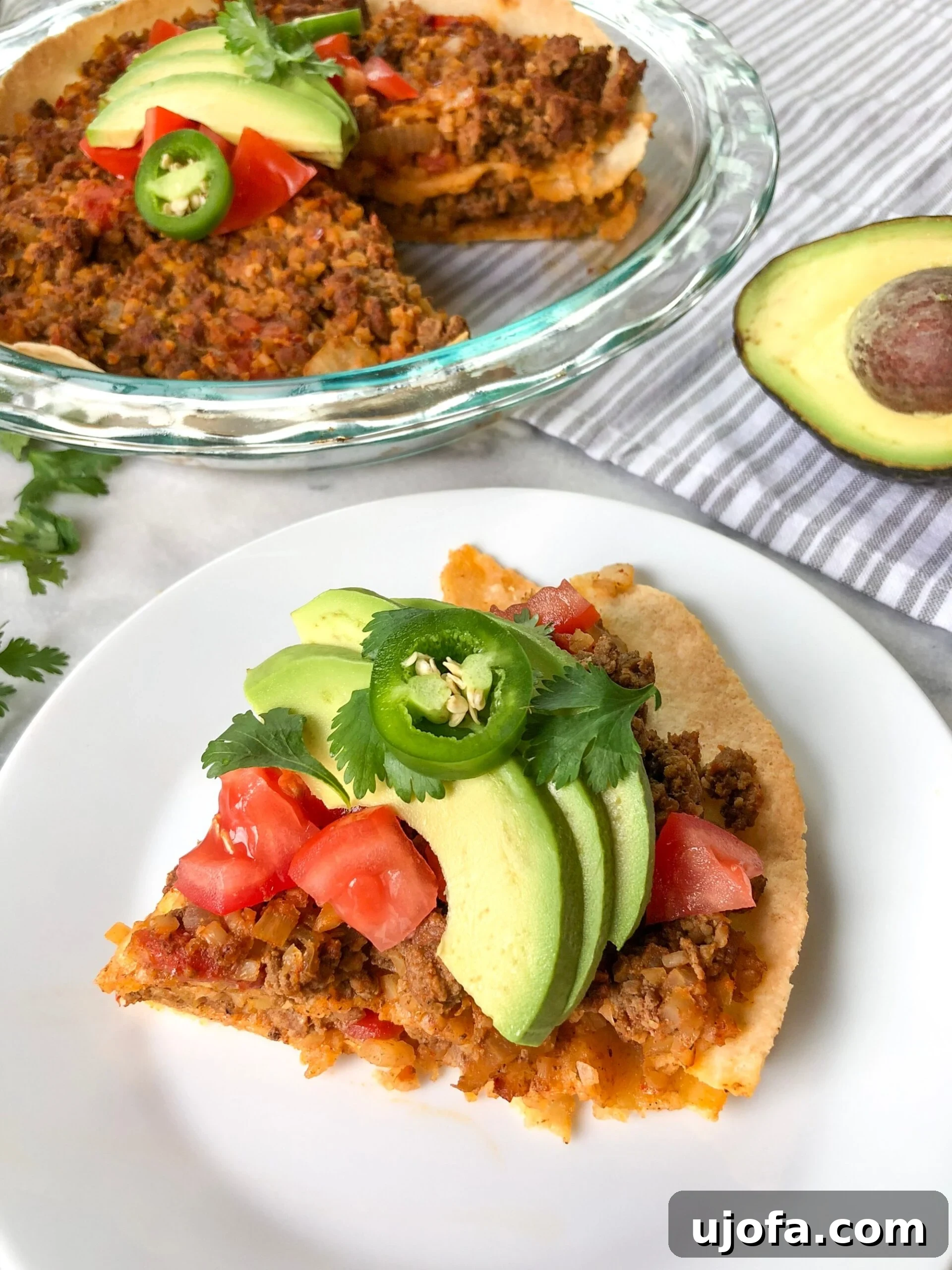Fiesta-Ready Whole30 Paleo Mexican Meals 21 Hearty Paleo Taco Pie, beautifully sliced and ready to serve, a delicious clean-eating dinner.