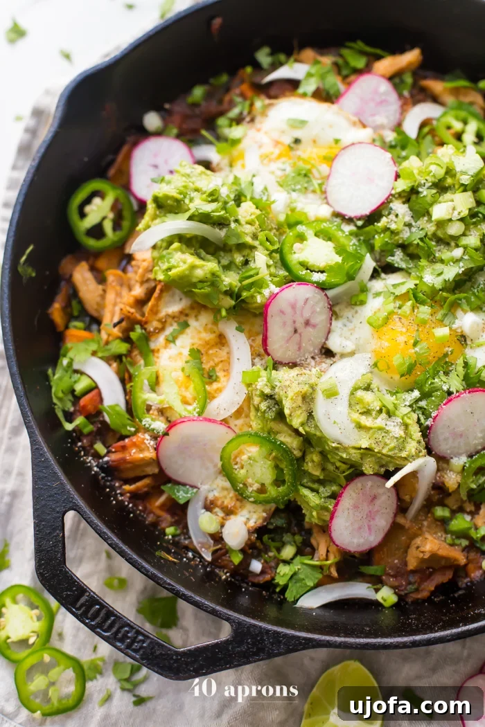 Fiesta-Ready Whole30 Paleo Mexican Meals 5 Whole30 Chilaquiles with Sweet Potatoes, topped with fresh cilantro and a fried egg.