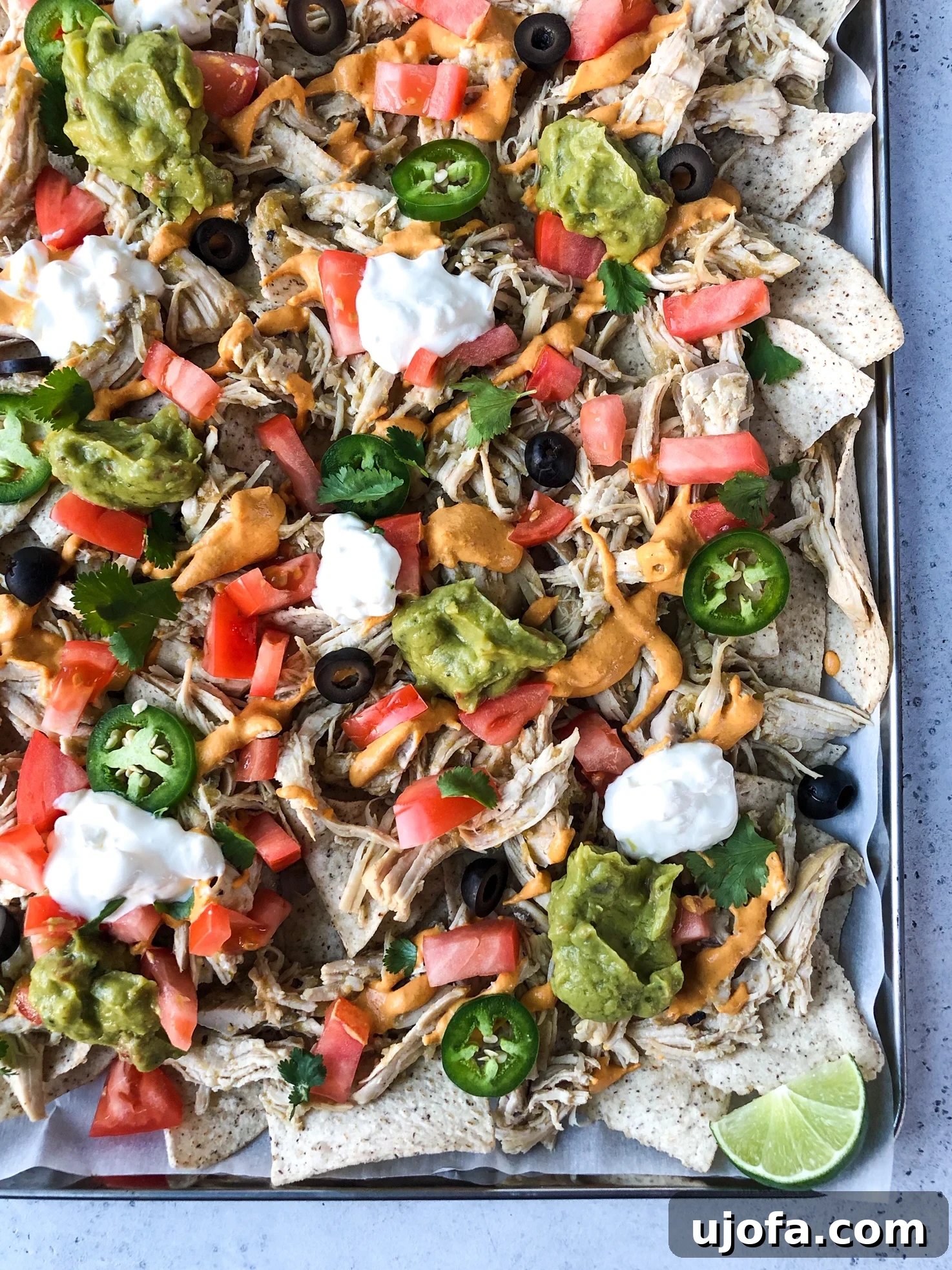 Effortless Whole30 Instant Pot Salsa Verde Chicken 3 Shredded chicken nachos with grain-free chips, queso, and fresh vegetables.