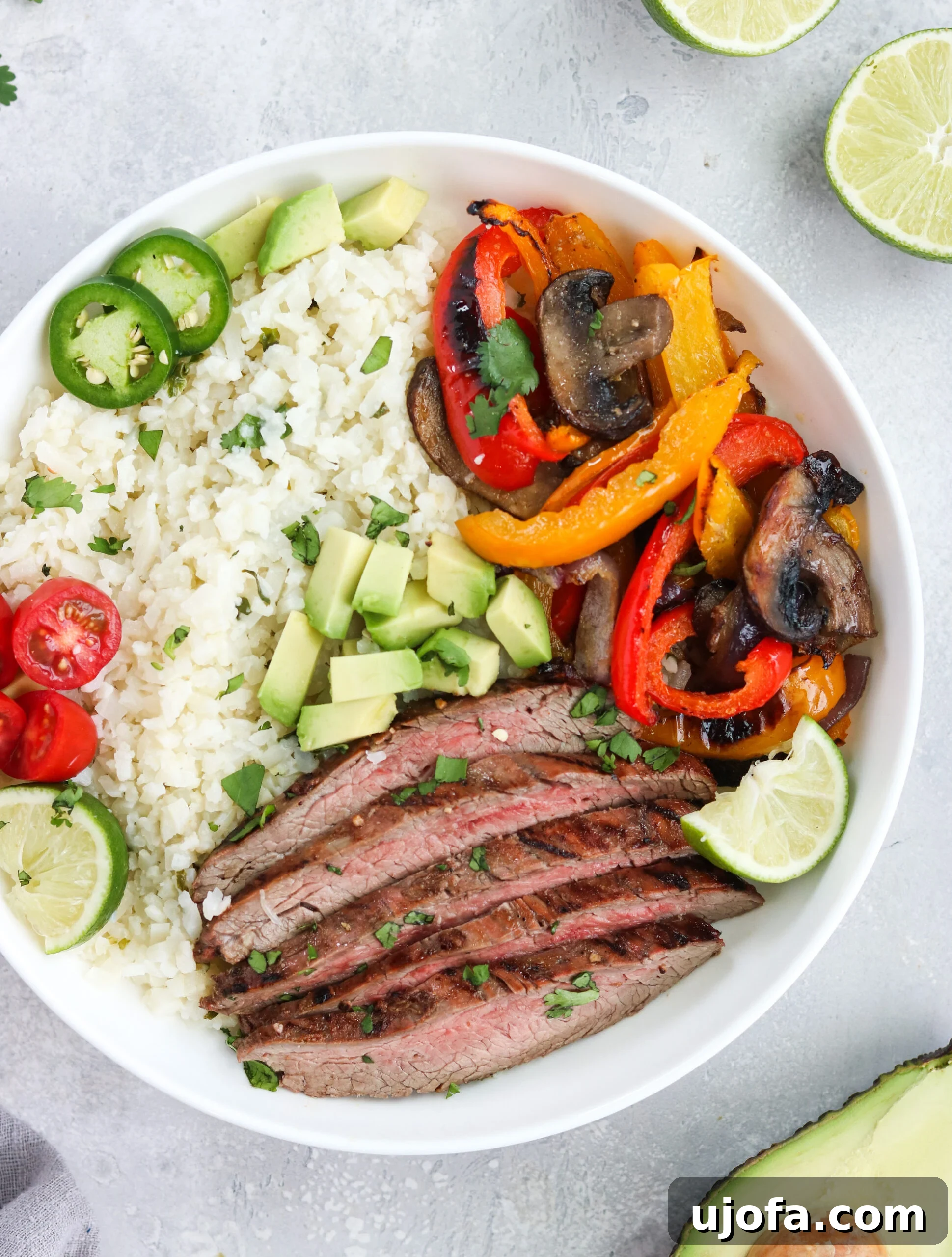 Whole30 Carne Asada Bowl with grilled flank steak and fresh toppings