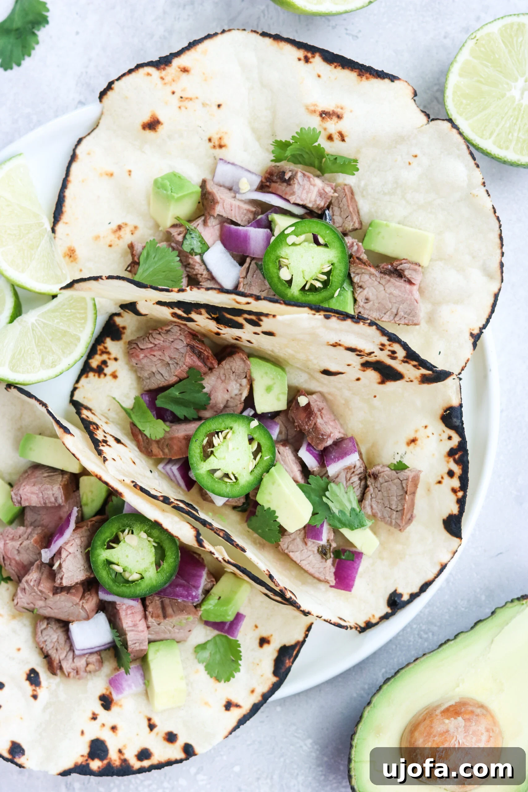 Paleo street tacos featuring grilled carne asada and fresh toppings