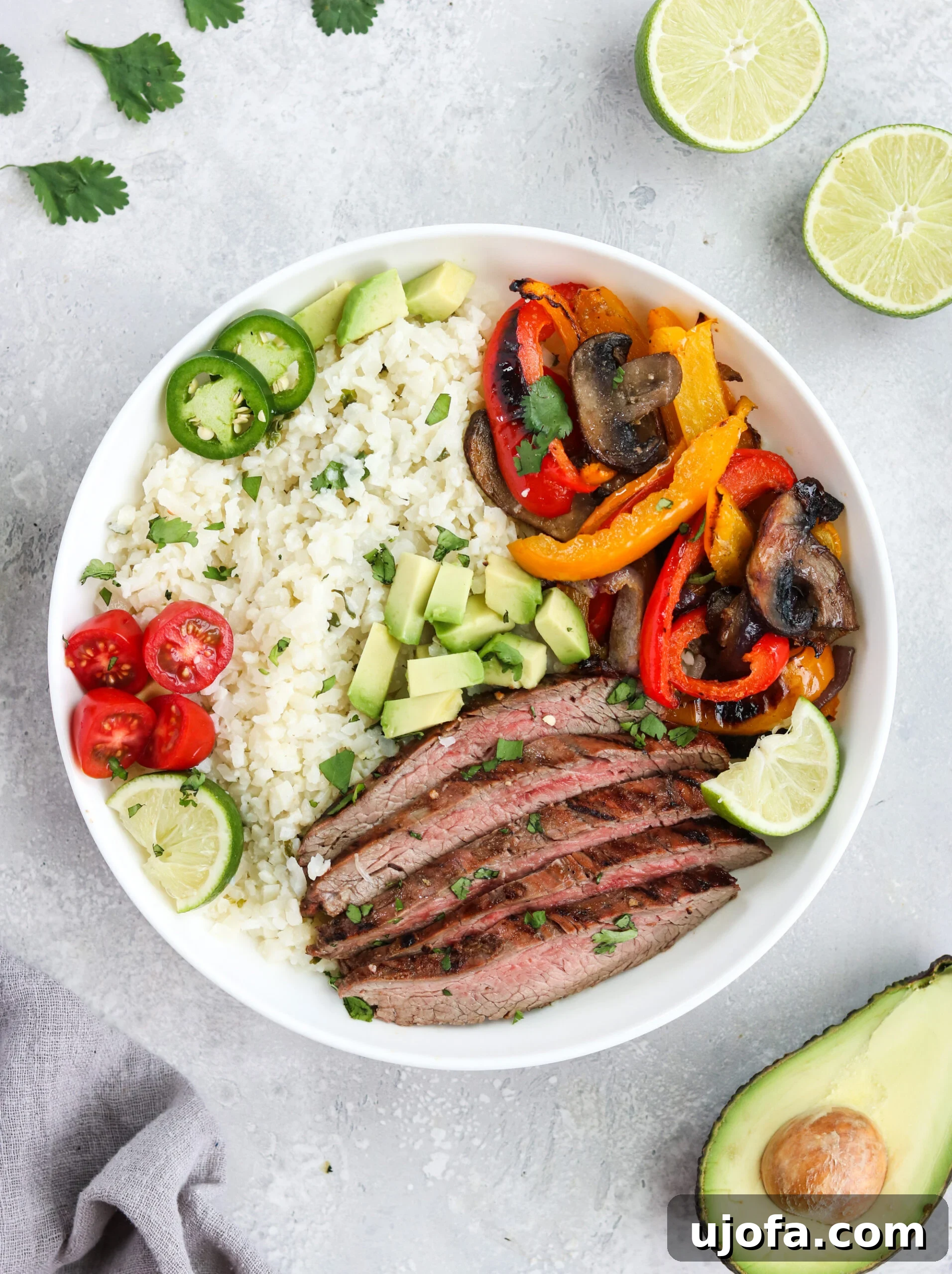 Array of Whole30 Carne Asada Bowls with colorful toppings