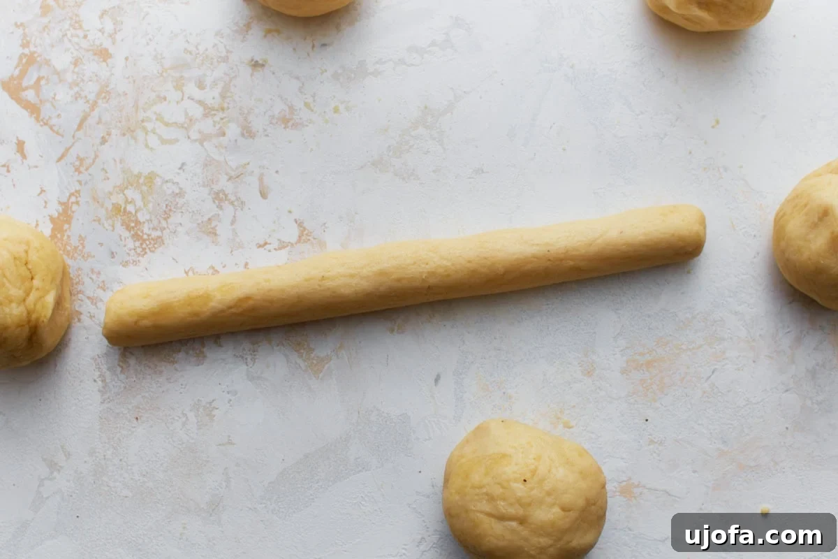 Perfect Keto Bagels 10 Soft, slightly sticky keto bagel Keto bagel dough rolled into a long rope on a light surface before shaping. fully mixed and ready to shape.