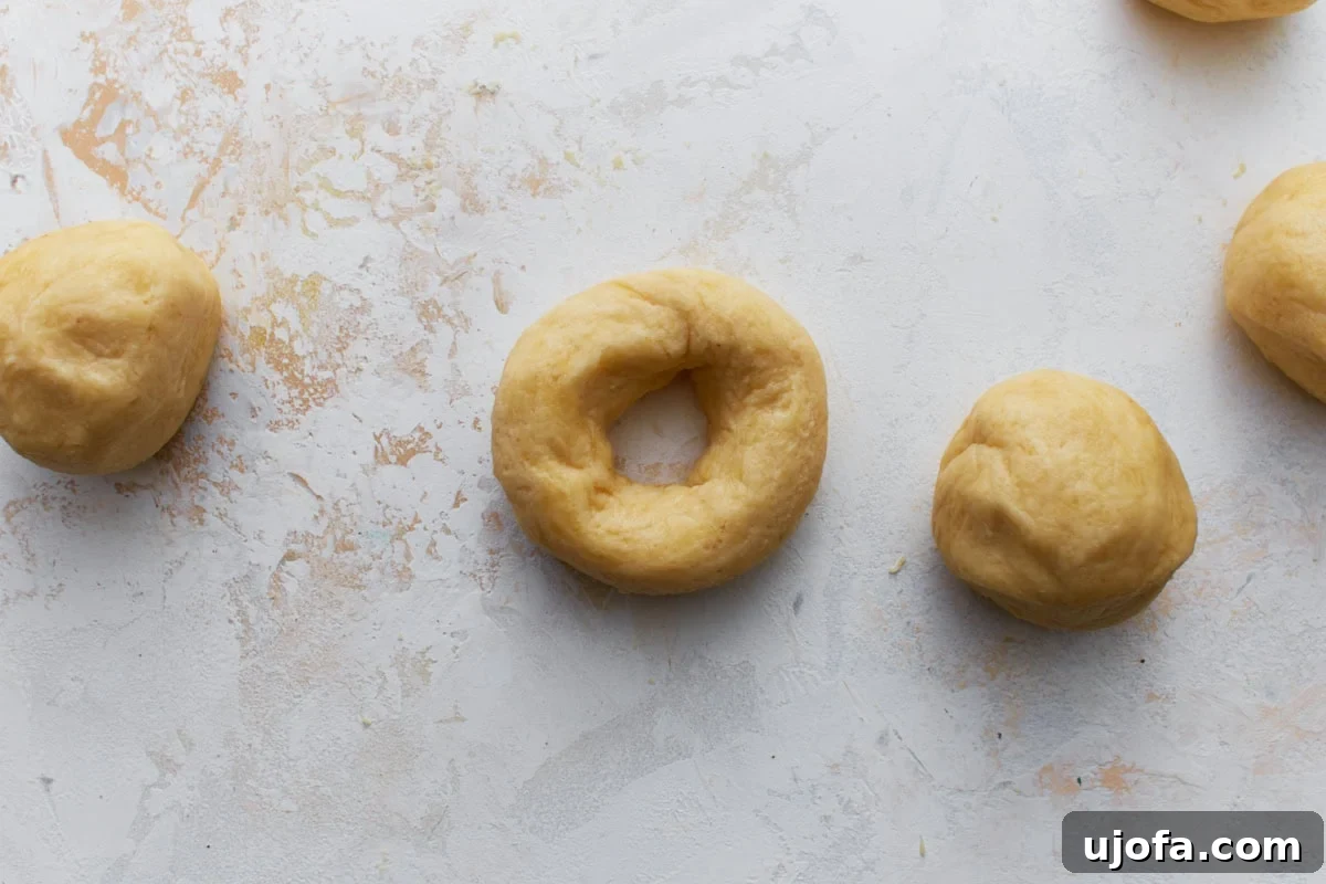 Perfect Keto Bagels 11 Portions of keto bagel dough shaped into rounds with holes in the center.