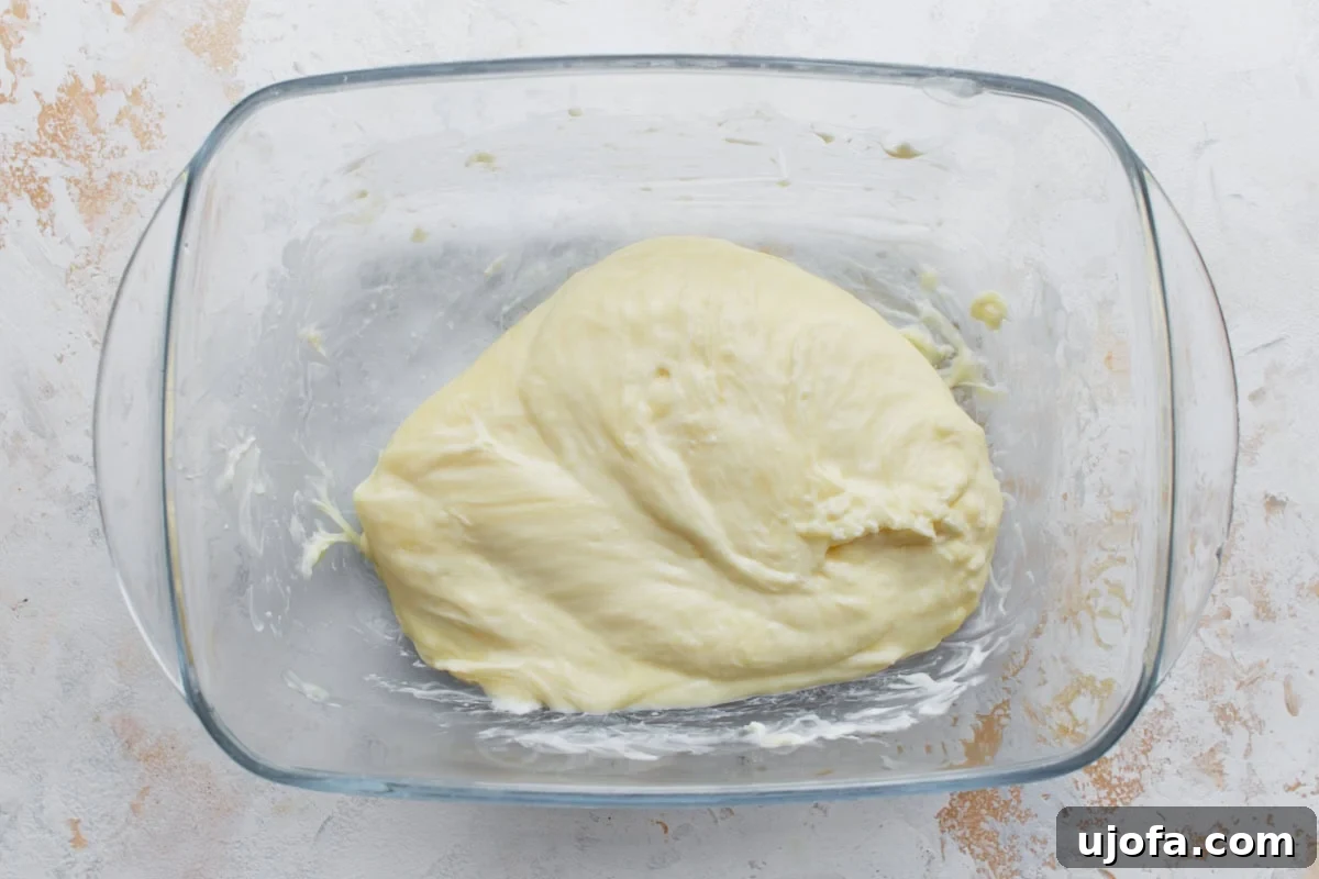 Perfect Keto Bagels 5 Melted mozzarella and cream cheese mixed together until smooth and stretchy in a glass bowl.