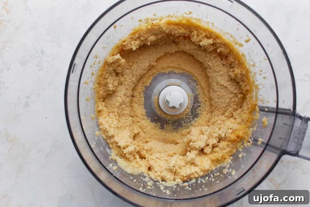 Perfect Keto Bagels 7 Eggs blended into the almond flour mixture in a food processor until thick and evenly combined.