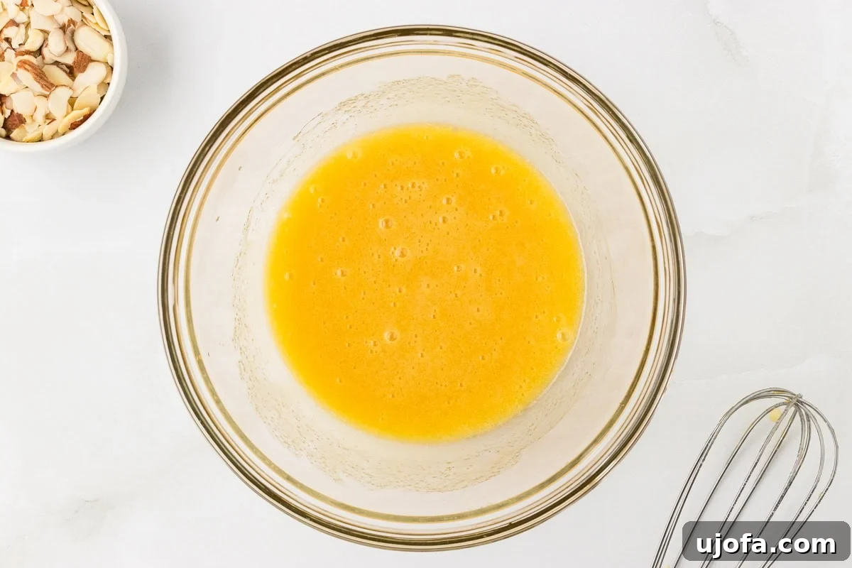 Tender Almond Scones 6 Melted butter, egg, and sugar mixture whisked smooth in glass bowl