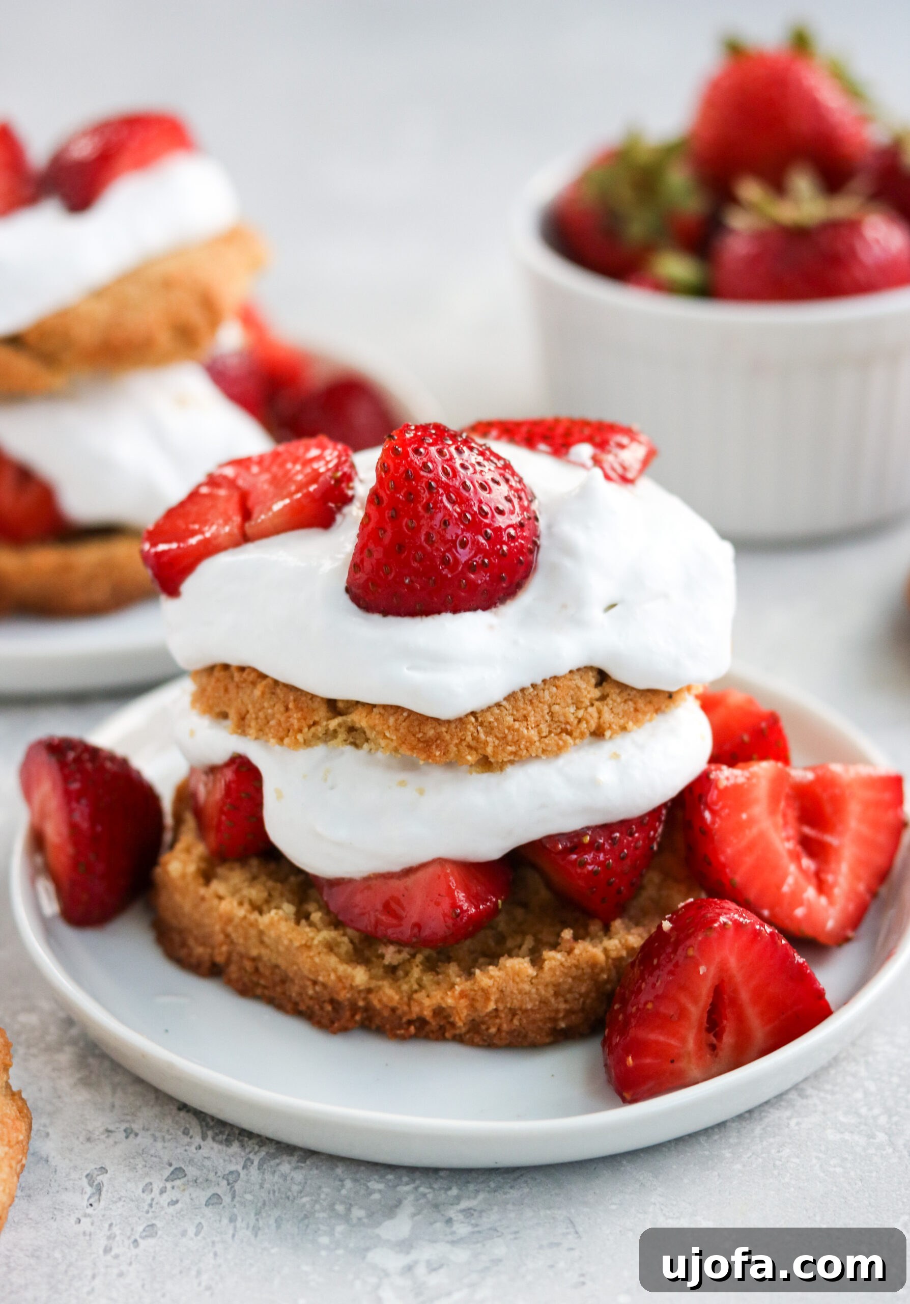Irresistible Paleo Strawberry Shortcake 2 Paleo Strawberry Shortcake with grain-free almond flour biscuits, fresh strawberries, and coconut whipped cream.