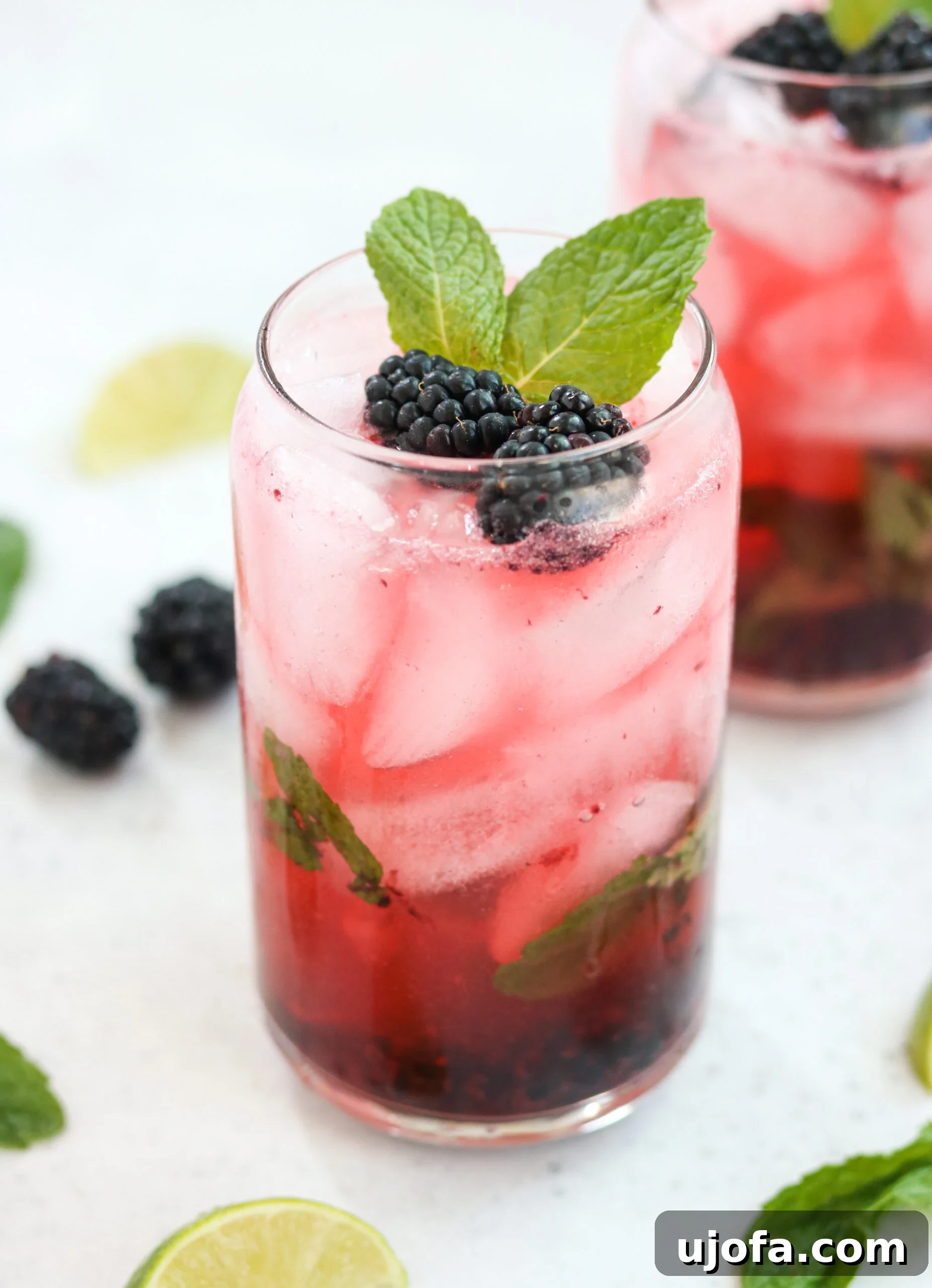 Paleo Blackberry Mojito in a glass, garnished with fresh mint and blackberries, ready for summer
