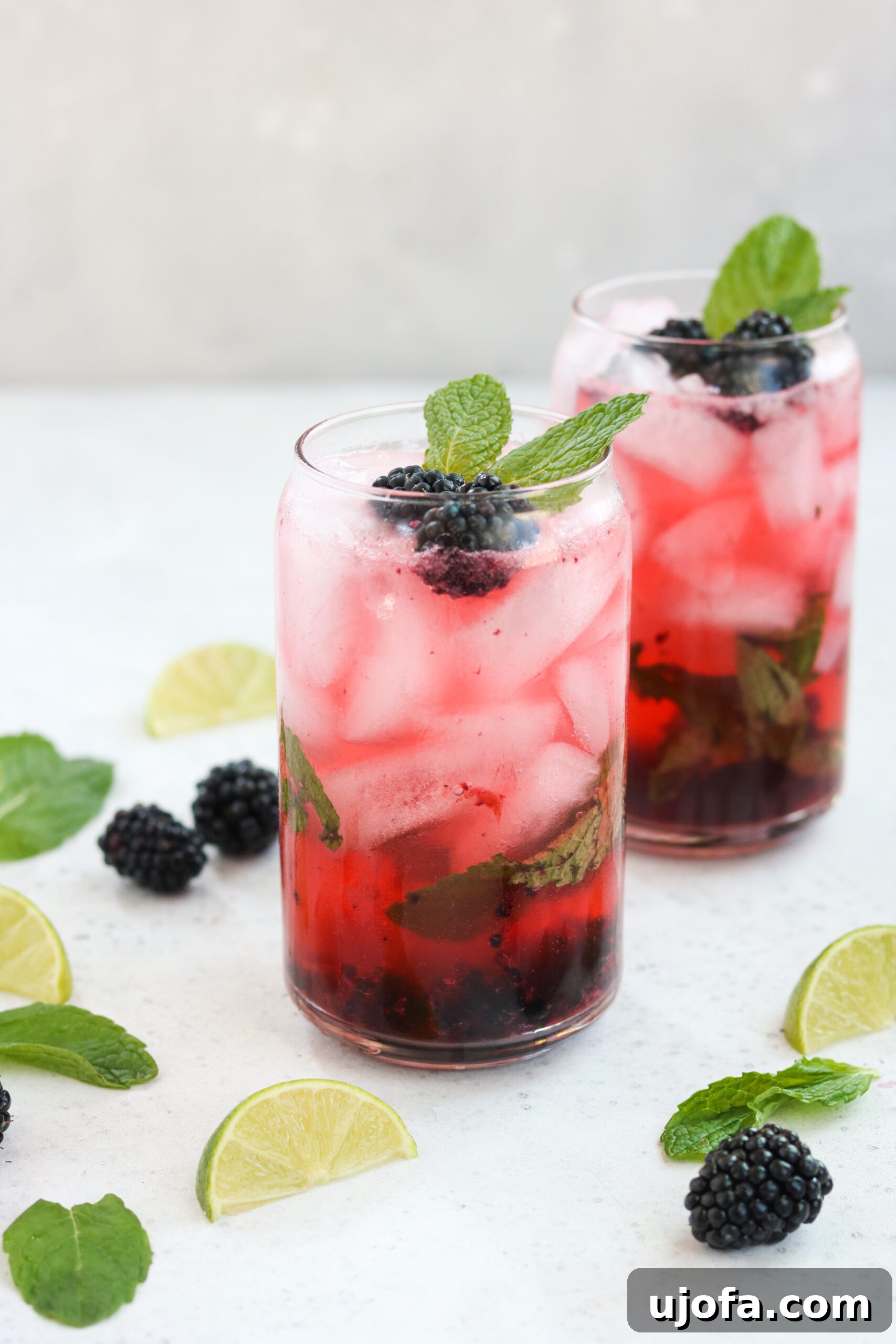 Close-up of a refreshing Blackberry Mojito with mint leaves and ice