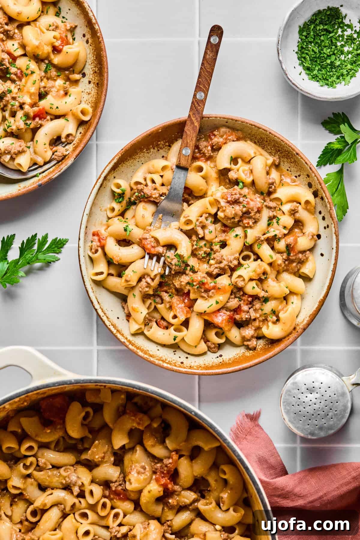 Two enticing bowls of homemade gluten-free hamburger helper, showing off the creamy pasta and ground beef.