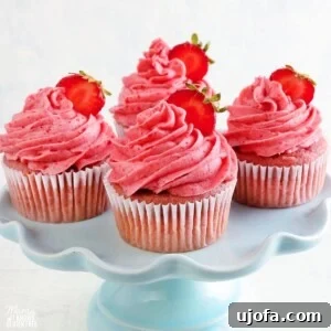 gluten-free strawberry cupcakes on a blue cake stand