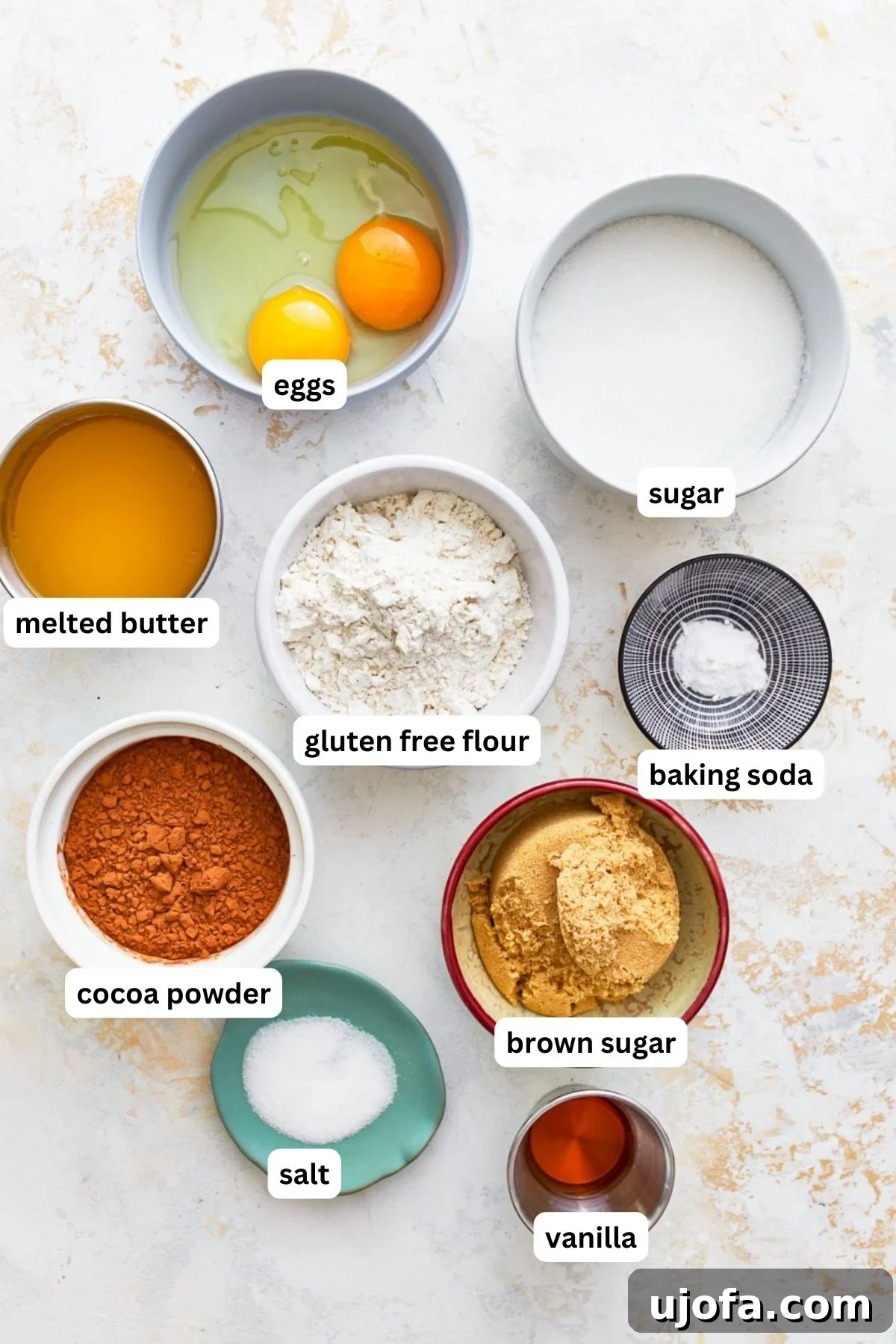 Fudgy Gluten-Free Brownie Perfection 3 A collection of ingredients for making gluten-free brownies, neatly arranged on a counter.