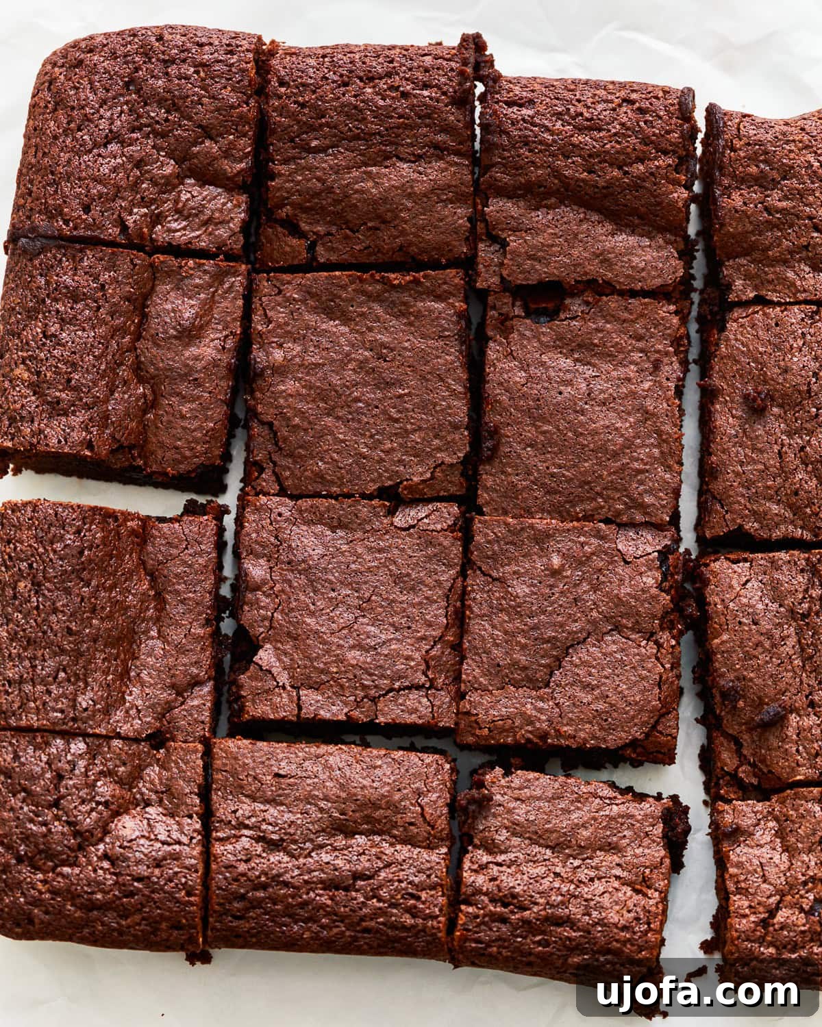 Fudgy Gluten-Free Brownie Perfection 4 An overhead view of perfectly cut gluten-free brownies, showcasing their moist and dense texture.